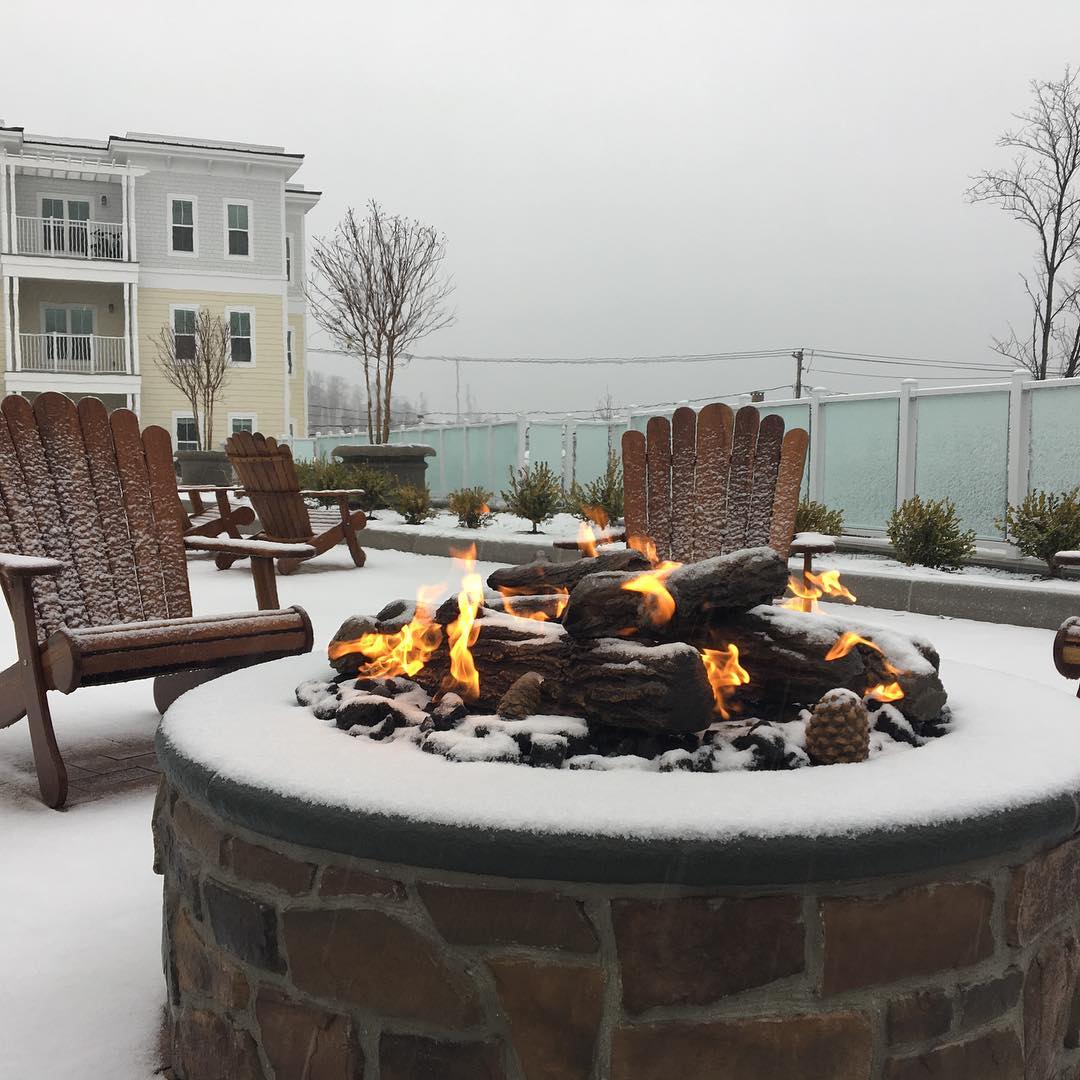 Outdoor fire pit looks beautiful on a snow day!